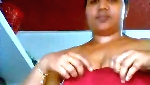 Sexy brunette milf in a sexy outfit taking photos of her body
