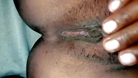 Indian girl with a hairy pussy fucks herself in the bedroom