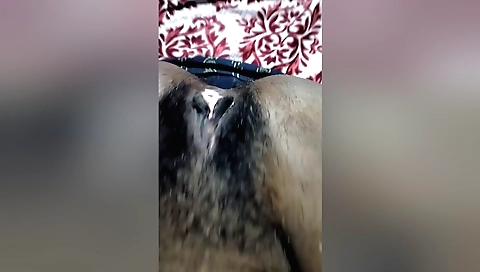 Indian teen with a hairy pussy stretches her pussy