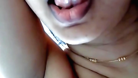 Indian wife masturbates with a dildo in front of mirror
