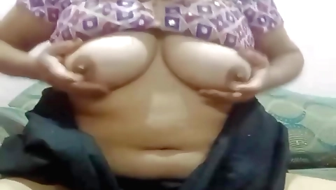 Busty chick with large natural breasts is showing her body