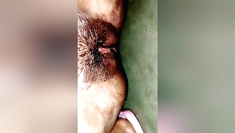Amateur girl strips naked and shows her hairy pussy