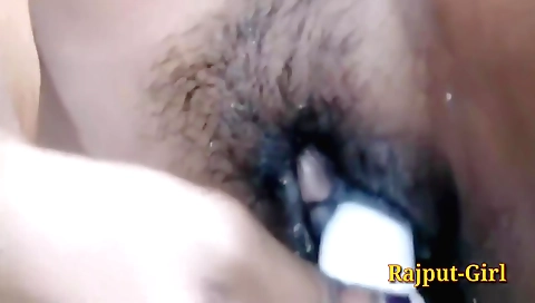 Bhabhi plays with her hairy cunt and moan while using a dildo