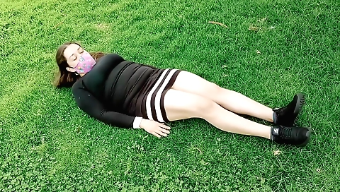 Busty brunette naked in a park to ride on a big dick