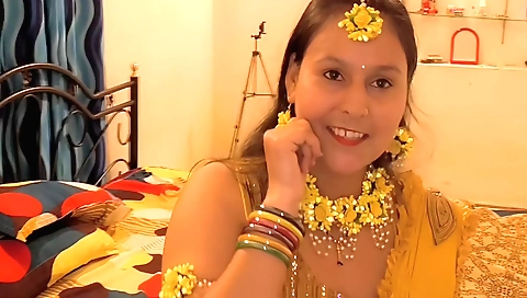 Indian brunette shows us the way and finger on a white towel