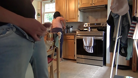 Amateur brunette in the kitchen with big boobs and tits