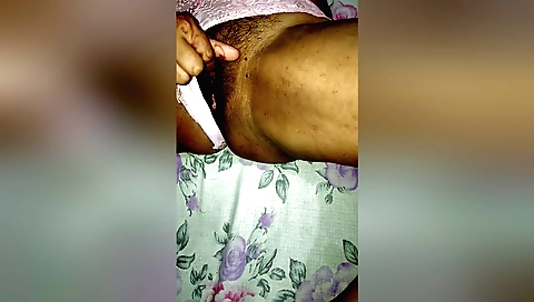 Bhabhi plays with her hairy pussy in an erotic style