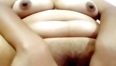 Hairy and chubby brunette strips naked and masturbates