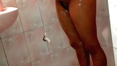 Horny brunette in a sexy bikini gets naked in the shower